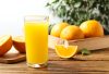 glassoffreshlysqueezedorangejuiceonthetablewith