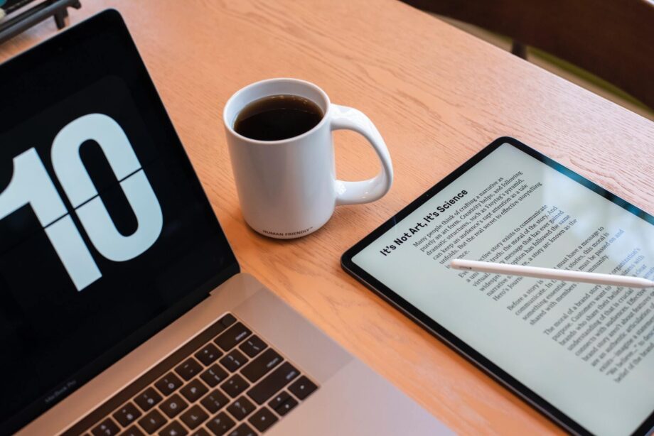 Laptop, coffee mug, and tablet showing text title 'it's not art, it's science'. Photo by CURVD® on Unsplash